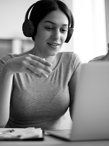 A woman talks with a provider online. 