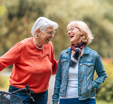 Two senior women laughing
