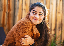 Woman opens her eyes and smiles