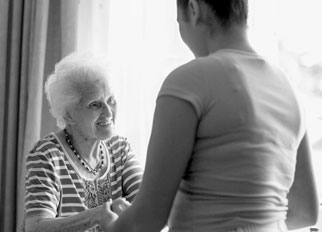 Caregiver helping elder women