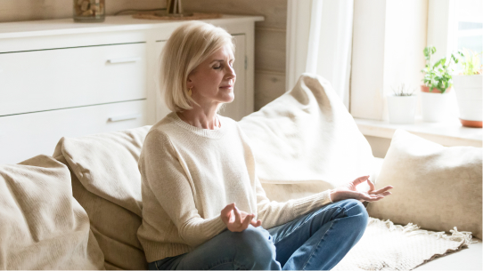 A woman calmly meditates