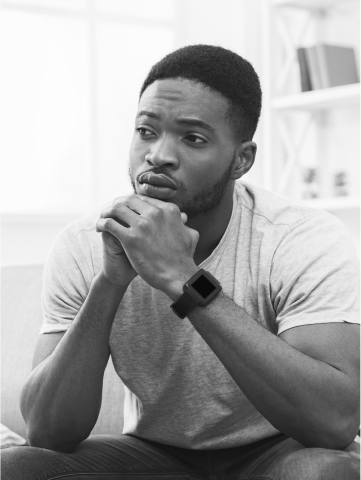 A man sits deep in thought