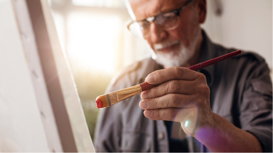 A man paints a painting