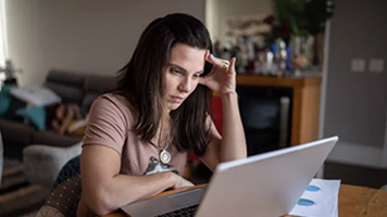 A woman sitting at her computer