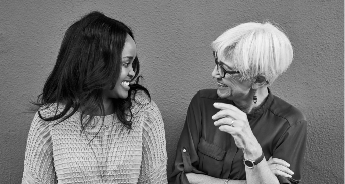 Two women support and uplift each other