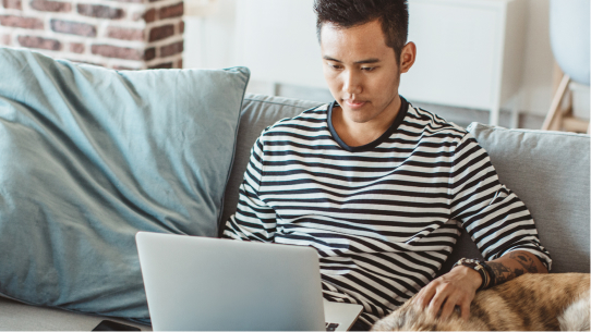 A man looks up mental health solutions on his computer