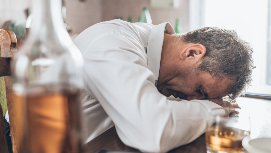 A man considers the negative effects of alcohol consumption