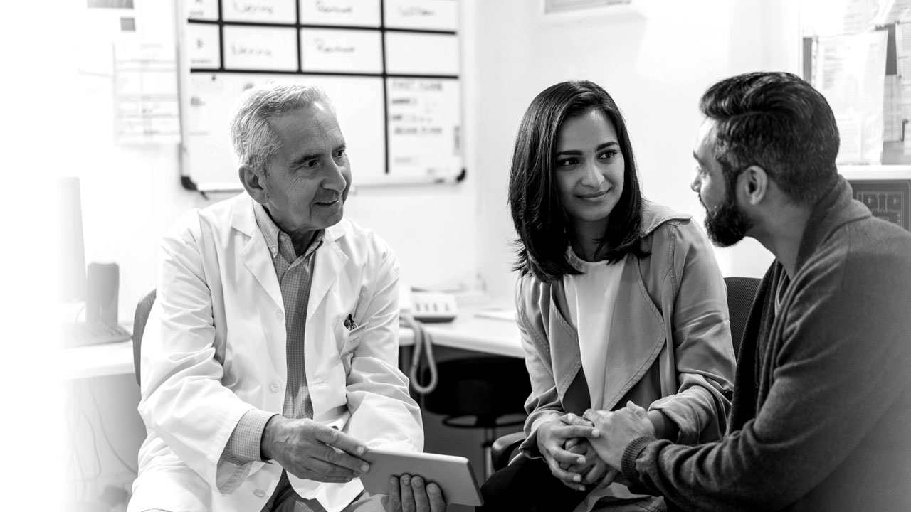 photo of couple speaking to provider