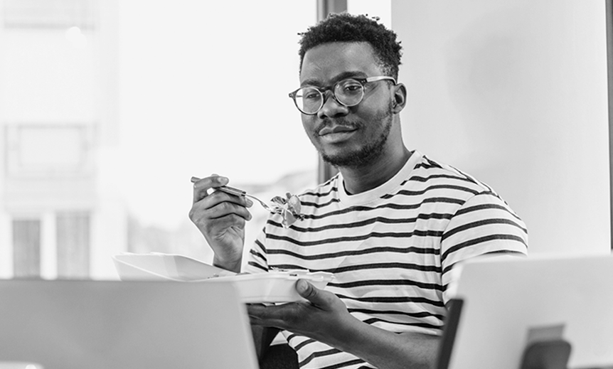  Man eating at desk