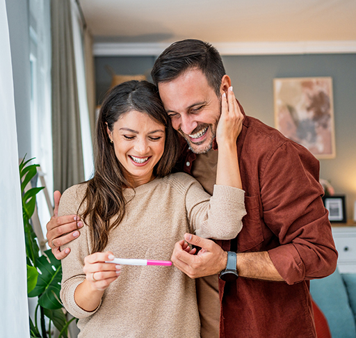 A couple looks at their pregnancy test results.