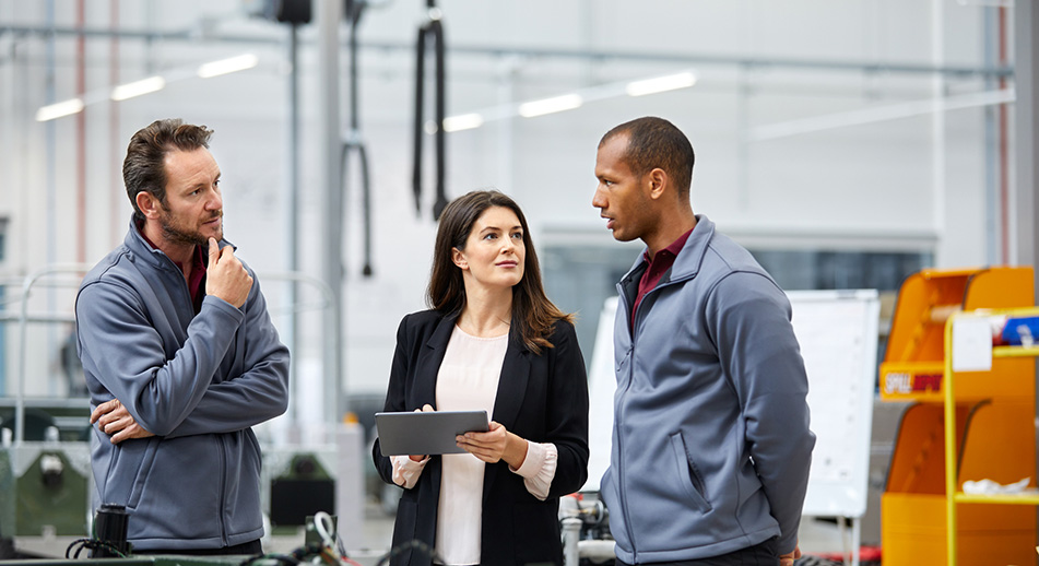 Three people talking in a business setting