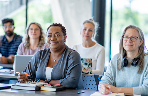 Coworkers learn about their health plan. 