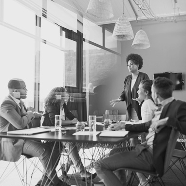 A woman holds a meeting in a conference room.