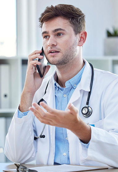 A provider talks to a patient over the phone.