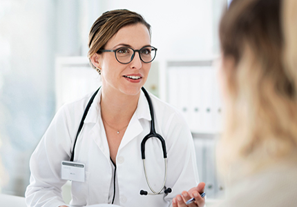 A doctor talks to her patient. 