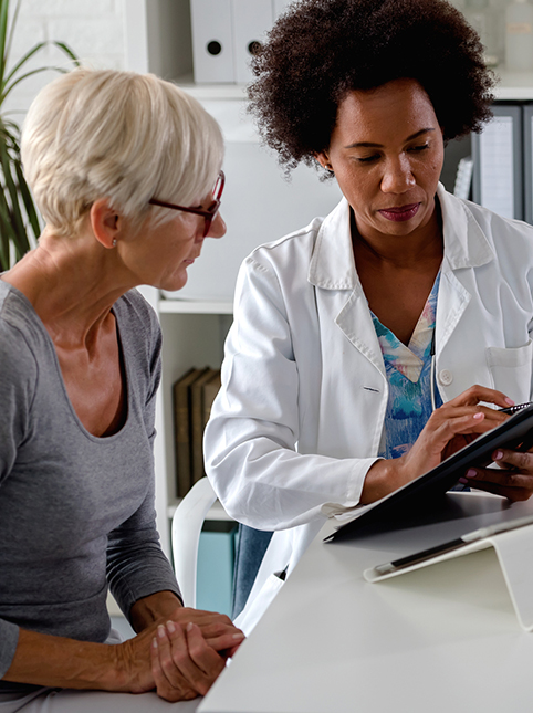  A doctor reviews paperwork with a patient