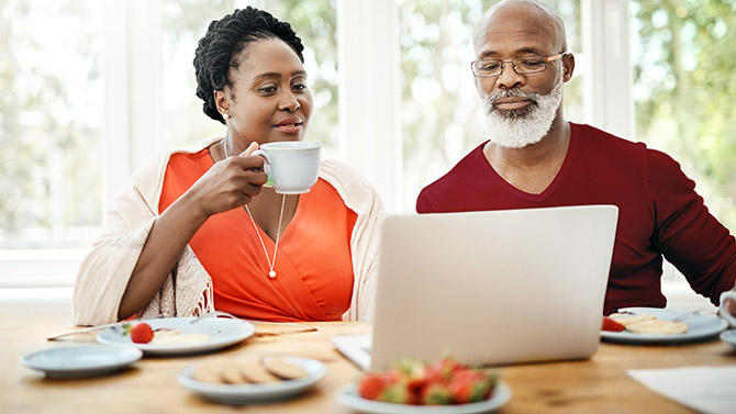 A couple looks up their options online. 