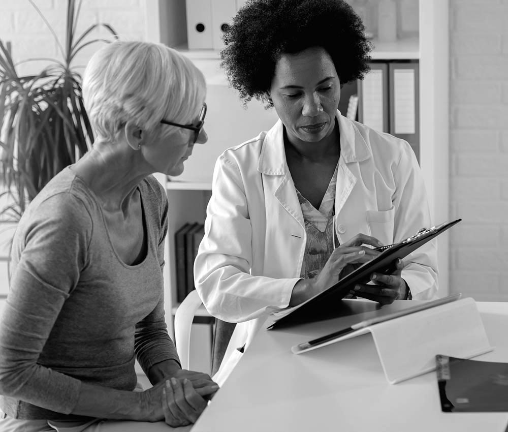  A doctor reviews paperwork with a patient