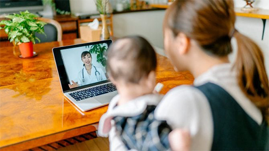 A mother and child go to an appointment online