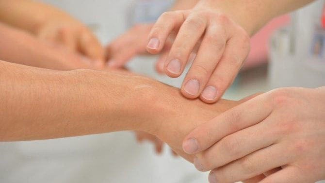 An urgent care doctor cares for a patient