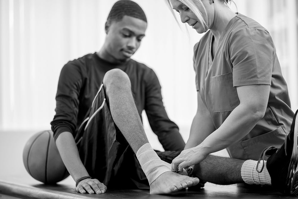  A nurse cares for an injured patient