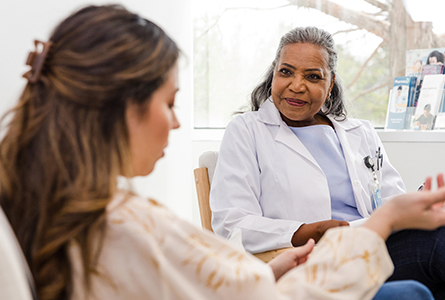 A woman and her doctor talk about a minor injury.