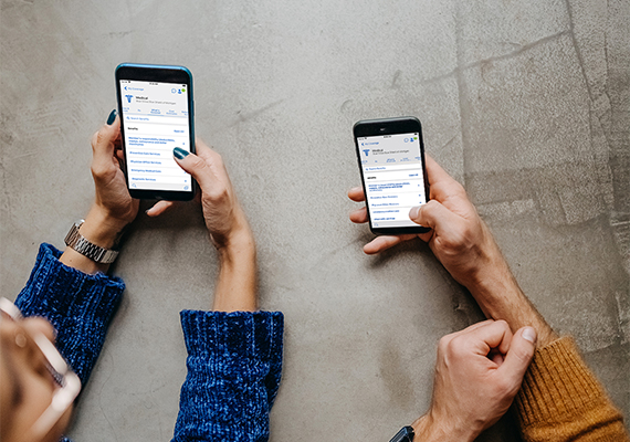Hands holding smartphones.