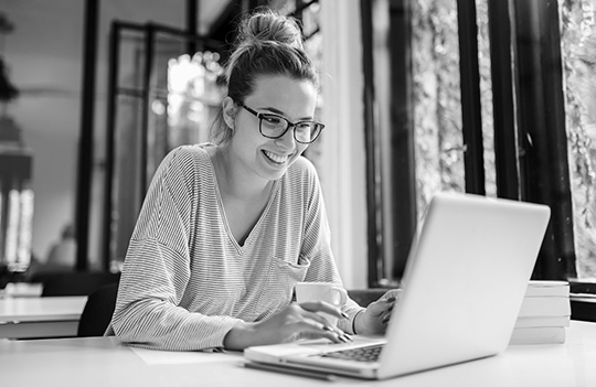 person looking at laptop computer