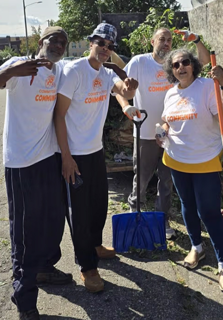 A group of volunteers pose for a photo.