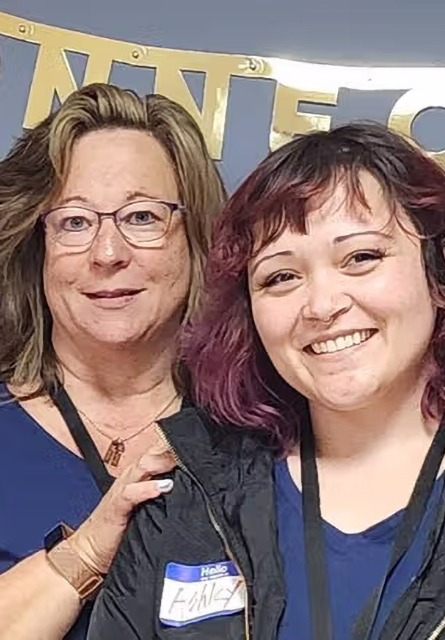 Two women pose for a photo