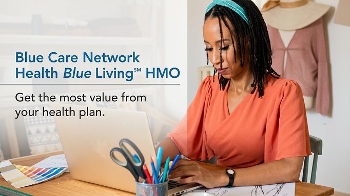 Cover image for Healthy Blue Living plan highlights video featuring a woman sitting at a desk typing on a laptop