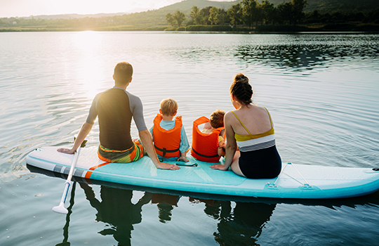 A family goes kayaking together. 