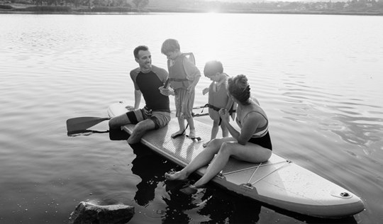 A family goes kayaking together.