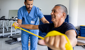 A patient working out with a physical thereapist