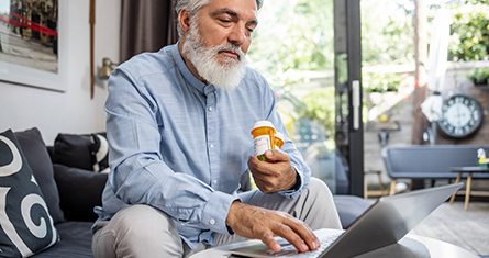 Man using laptop prescriptions