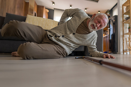 An older man on the floor after a fall