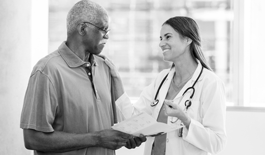 Medicare member talking to doctor about care.