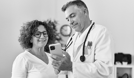 Woman discussing information on phone with Medicare care provider. 