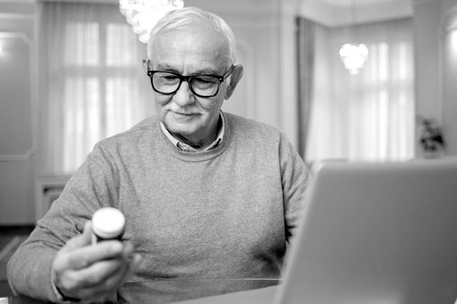 Man using laptop prescriptions