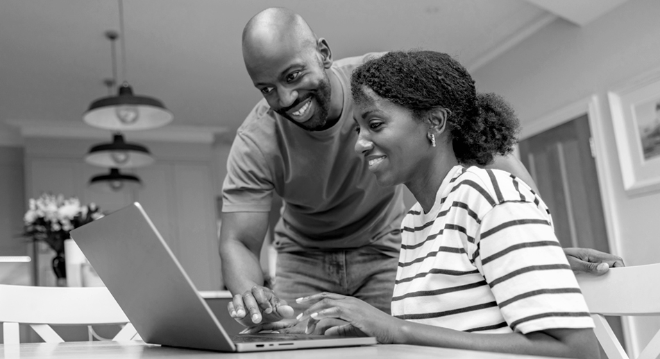 A couple looks over their documents online. 