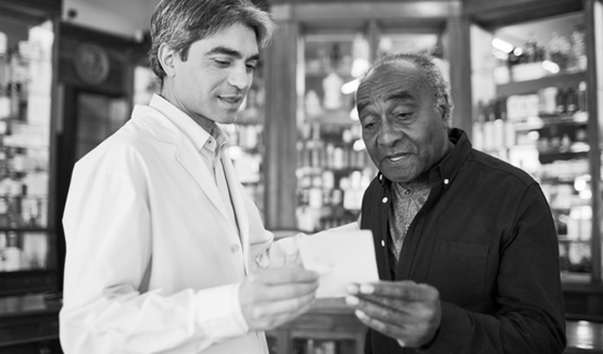 A man talks to his pharmacist.