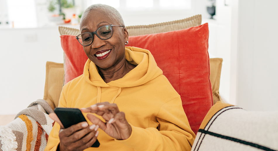 Smiling woman holding a mobile phone