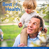 Spring 2023 newsletter cover featuring a man and with a little boy underneath a flowering tree.