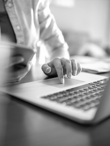 A member looks up their options on their smartphone and computer