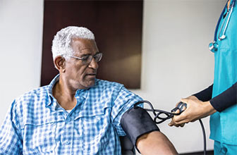 A man gets his blood pressure checked.