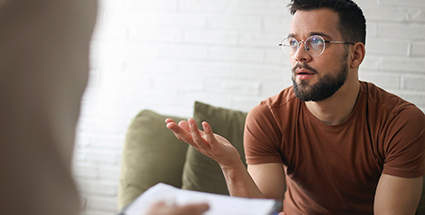 A man speaking with his therapist
