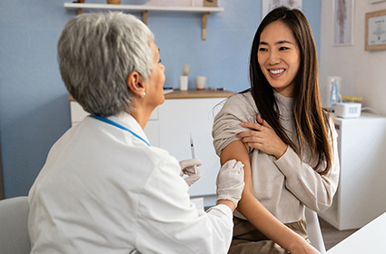 Pharmacist talks to man