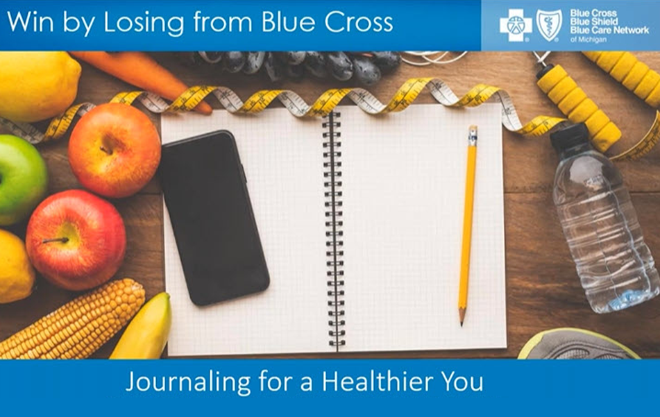 A blank book sits on a table next to some fruit and a pencil. 
