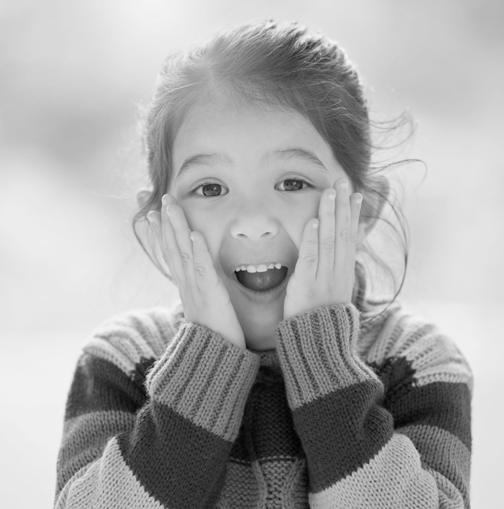 Young girl looks surprised