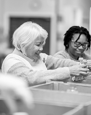 Volunteers sort through boxes